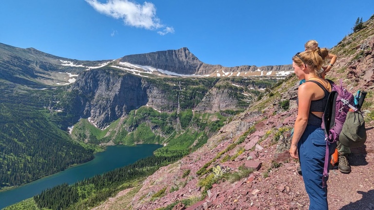 Dani Owens looks to Medicine Grizzly lake and Razoredge Mountain on the way to Triple Divide Pass in Glacier National Park, Montana.