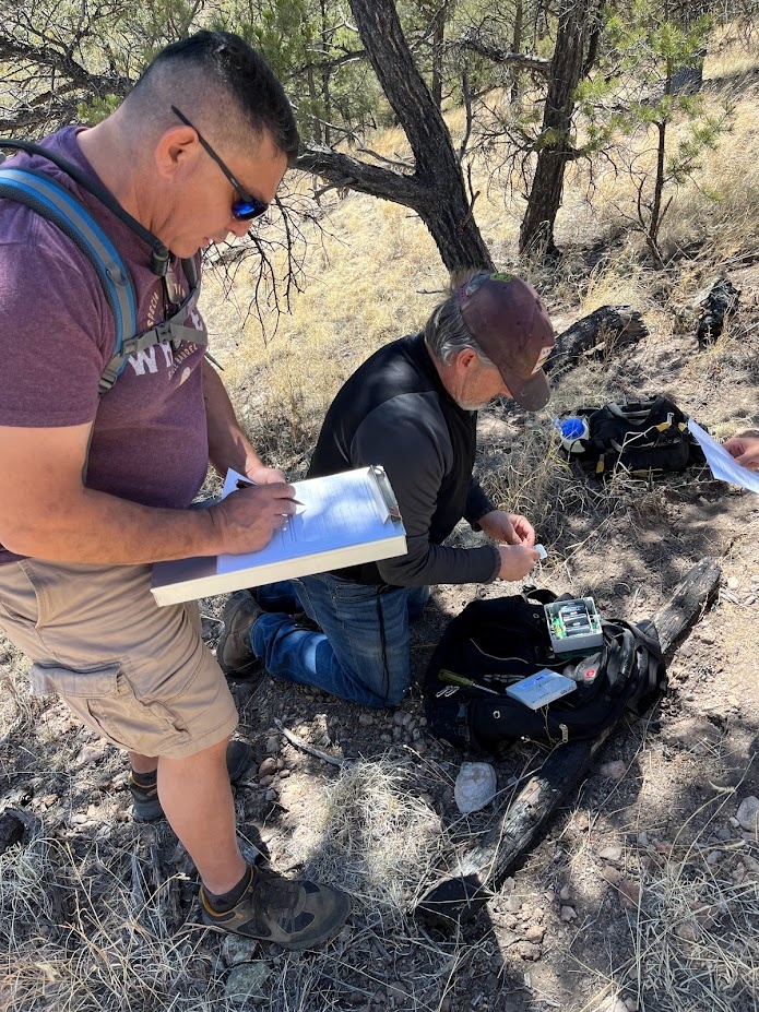 Ron Maes and Jack Williams deploy an acoustic recording unit on the Gila National Forest in New Mexico.