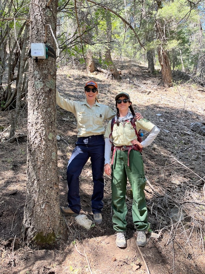 Paige and Andrea pose with the first-ever acoustic recording unit deployed on the Cibola National Forest as part of a collaboration with RMRS.