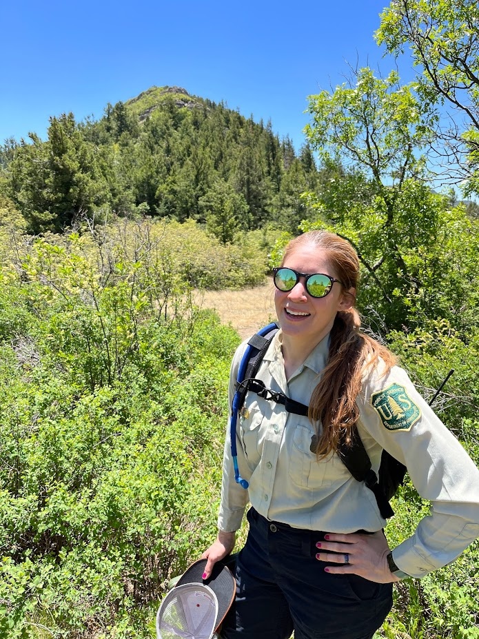 Andrea Chavez, the Forest Biologist for the Cibola National Forest, New Mexico, pauses on the crest of the Manzano Mountains.