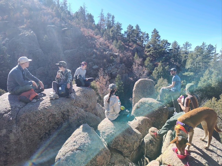 A sun-soaked snack break during a lab hike in the Sandia Mountains.