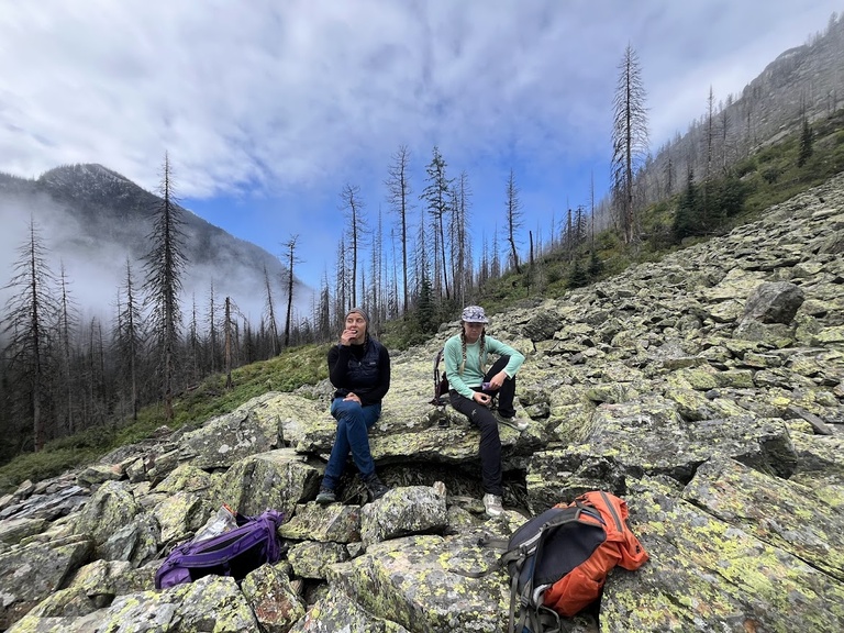 Jami Belt (National Park Service) and Dani Owens take a lunch break during a pika survey in Glacier National Park, MT.