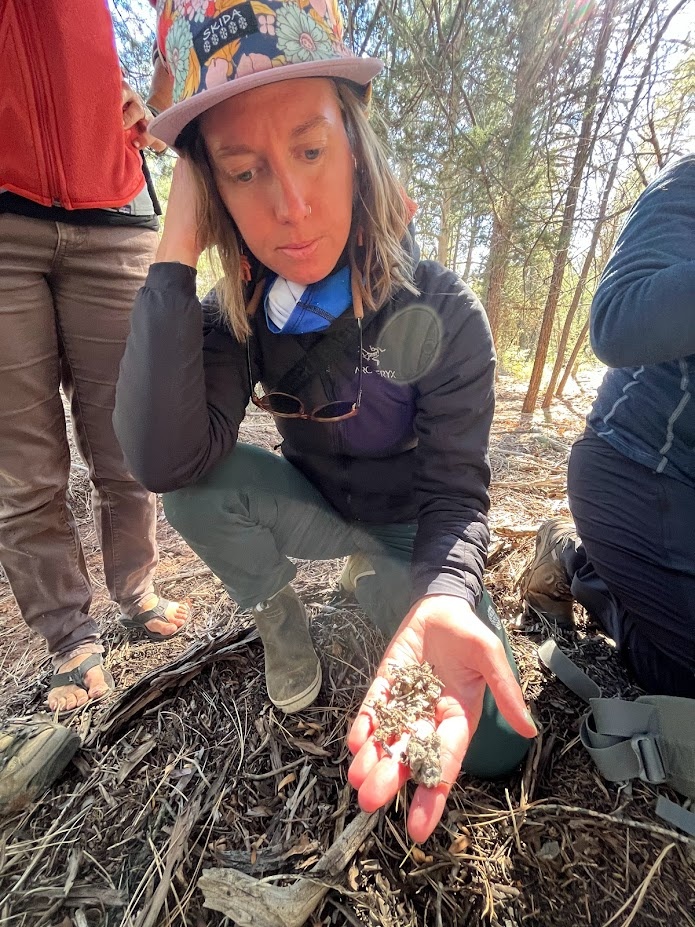 Ceeanna Zulla holds fragments of a Mexican spotted owl pellet on the Tonto National Forest, Arizona.
