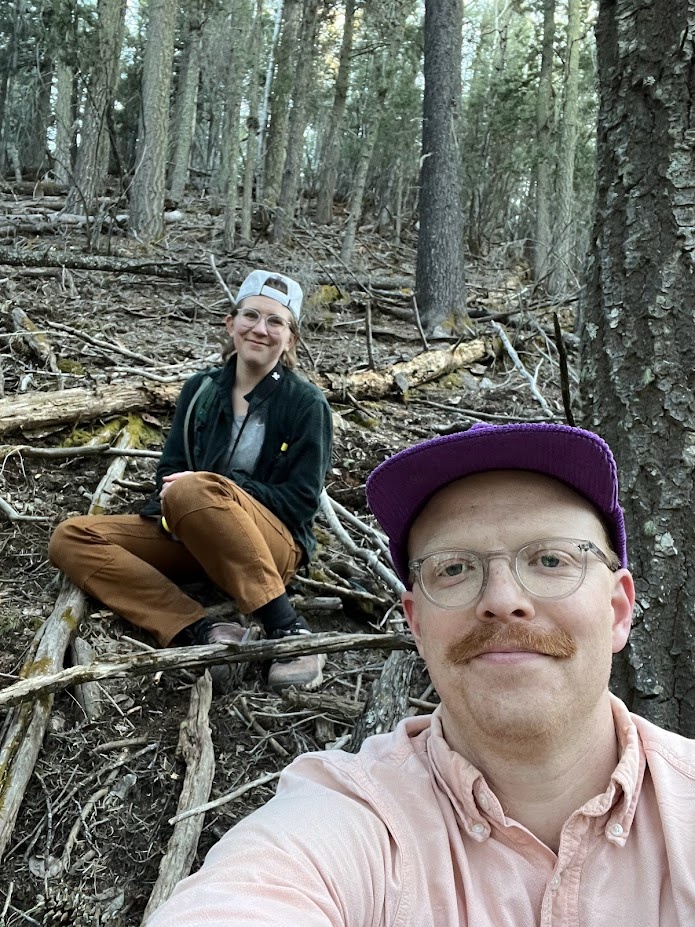 Gavin and Michaela sit in the woods and wait for the owls to wake up.
