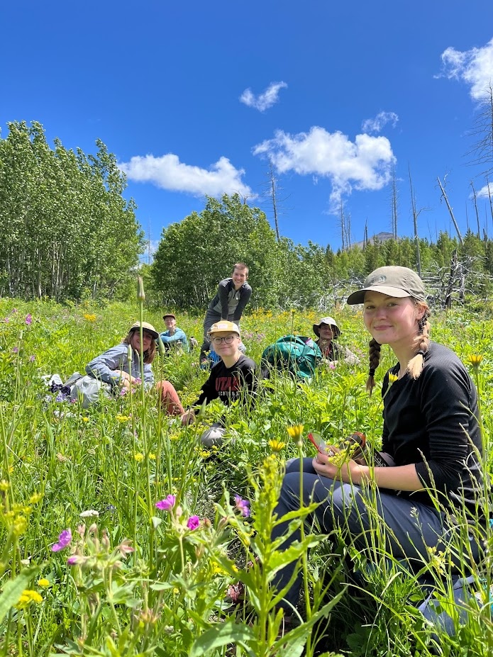 Snack time on the trail in Glacier National Park, Montana.