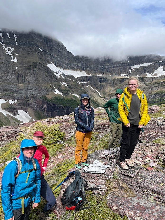 Team Pika (Maloree, Jessalyn, Dani, Lucas, Lexie, L-R) taking a breather on their way to a summit in Glacier National Park, Montana.