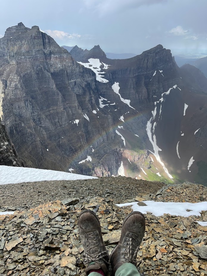 Have you ever seen a rainbow from above? Gavin on the summit of Ipasha Peak in Glacier National Park, Montana.