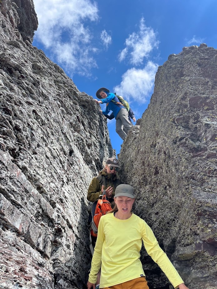 he pika crew descends a class 4 section of Bishop’s Cap in Glacier National Park, Montana.