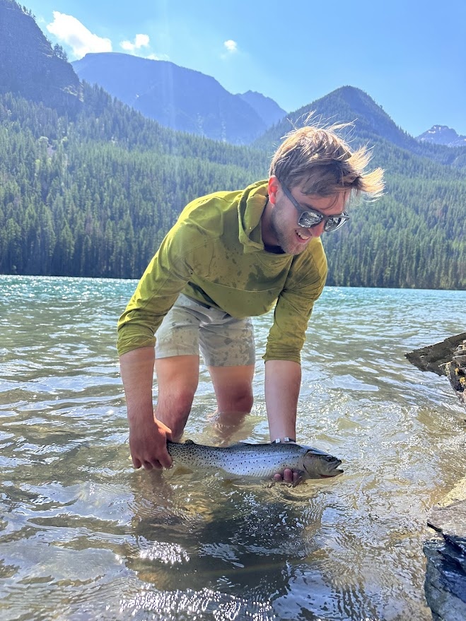 Field technician Michael Cushing doesn’t need a freeze-dried backcountry dinner, he’ll catch his own!