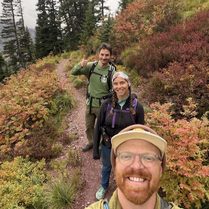 Gavin, Jami Belt, and Lucas Moyer-Horner snap a selfie on a hike to Triple Divide Pass in Glacier National Park.